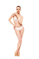 Fototapeta premium Beautiful underwear model posing on a white background