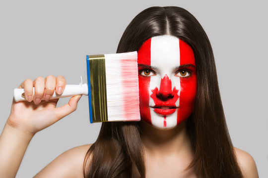 The woman's face in the national colors of Canada