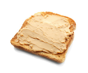 Tasty toast with peanut butter on white background