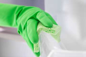 Woman cleaning refrigerator with rag © Africa Studio