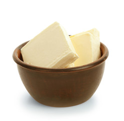 Bowl with tasty fresh butter on white background