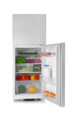 Open refrigerator full of food on white background