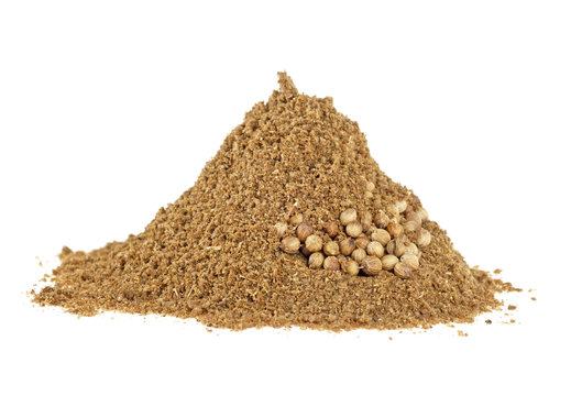 Seeds and powder of coriander spice on white background