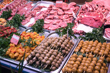 Raw meat in butcher's shop showcase