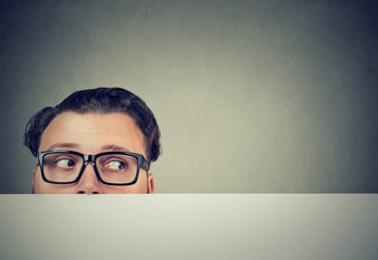 Worried man looking out of table