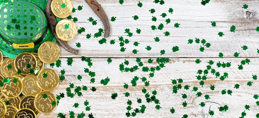Lucky hat and gold for St Patrick Day on rustic wood