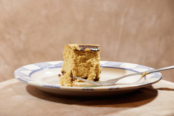 part of a pumpkin cheesecake with plate and fork