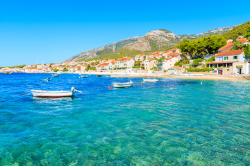 Turquoise sea and colorful fishing boats in Bol port, Brac island, Croatia