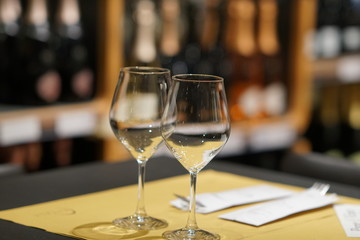 Two glasses full of white wine. Selective focus
