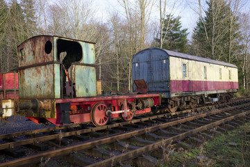 Fototapeta na wymiar Train carriage abandoned on old railway disued steam engine