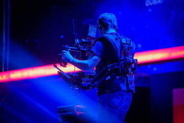 Steadicam man working on stage at concert