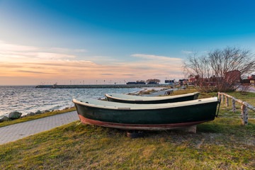 Fototapeta na wymiar Fishing boats on the shore of Baltic Sea in Kuznica village on Hel Peninsula in Poland.