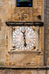 Closeup on the clock face on the 16th-century clock tower of the Church of St. John the Baptist in Tomar, Portugal