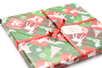 Present box tied by red bow and decorated by Christmas illustration (tree, animals, snowflake) isolated on white background .