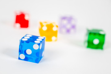 five color dice over white