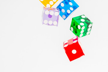 five color dice over white
