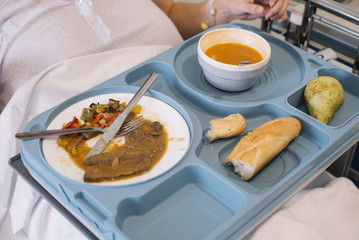 woman eating in the hospital