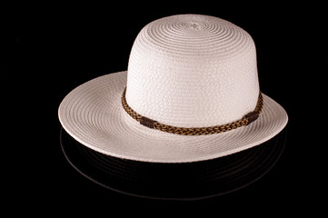 Stylish female hat isolated on the black background