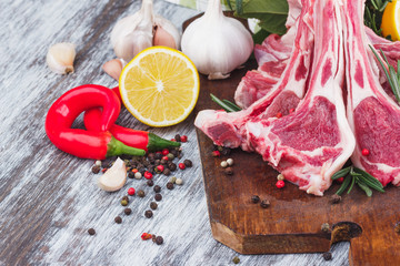 Raw lamb chop on the wooden board