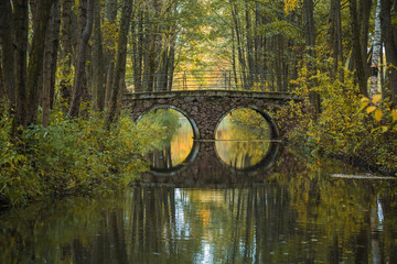 Beautiful scenery in Belarus. Magnificent autumn in the European city. A beautiful bridge across...