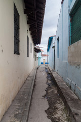 Narrow dirty alley in Sancti Spiritus, Cuba