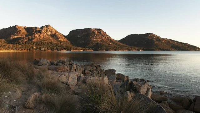 a view of coles bay and the hazards on the east coast of tasmania, australia at sunset