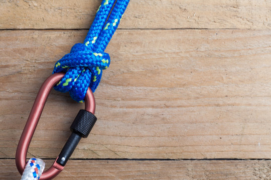 Bull Hitch Knot with Blue Rope on Carabiner with copy space