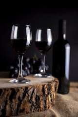 chalice wine and bottle on the log