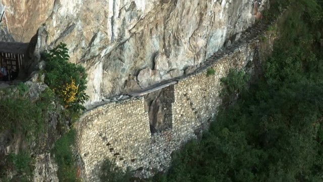 tilt down shot of the amazing incan bridge at machu picchu