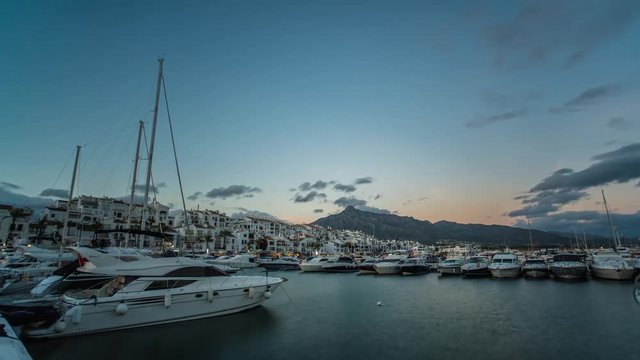 Day to night timelapse of Leisure port in Marbella at sunset. Beautiful landscape in marbella harbor