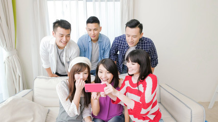 young people look phone happily