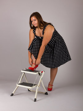Beautiful Curvy Teenage Girl in Polkadot Dress and Red Heels