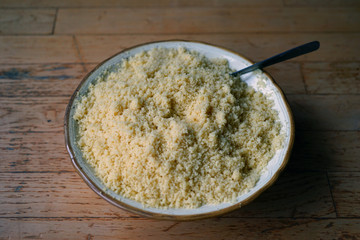 A bowl of fluffy semolina North African wheat couscous 