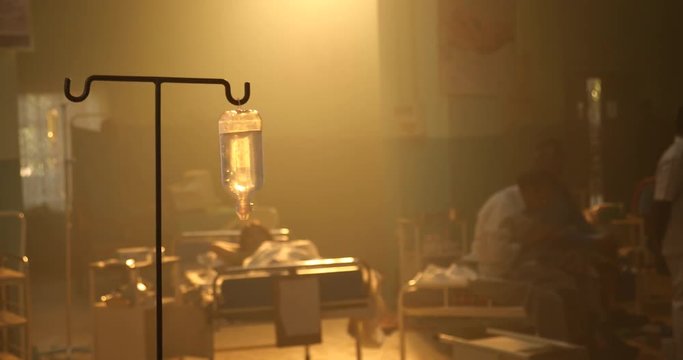 saline bottle hooked on the stand