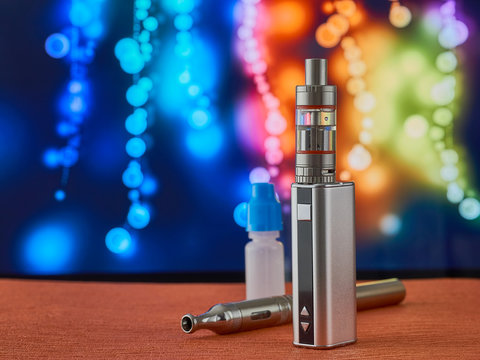 vape, electronic cigarette in front of a colorful background