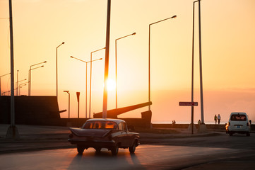 Sunset on the Malecon in Havana on a daily day in Cuba