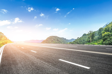 country road and mountains natural landscape in the summer