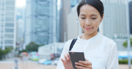 Businesswoman use of mobile phone