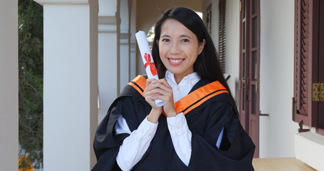 Cheerful woman get graduation in university campus