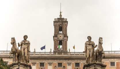 2 statues and clock
