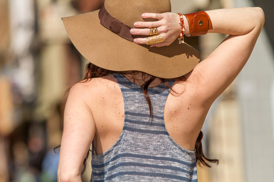 Redhead Woman In A Big Sun Hat