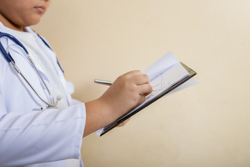 Close-up of a man doctor filling out application form