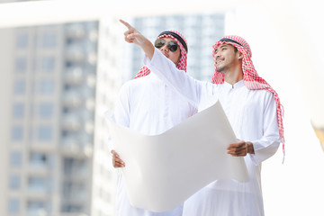 Arab business man looking working on plan peper in the city