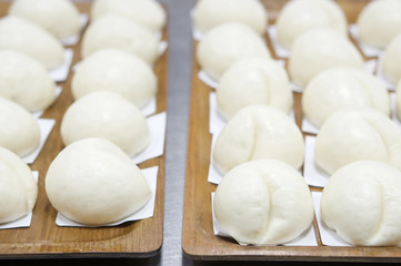 Fototapeta na wymiar White steamed bun or dim sum at restaurant kitchen