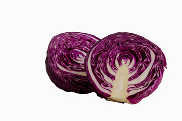 Fototapeta premium White isolated background with clipping paths of half fresh purple cabbage in side view to present surface or texture. Prepare vegetable for cooking cabbage salad or coleslaw. Homemade food concept.
