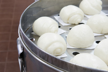 Fototapeta na wymiar White steamed bun or dim sum at restaurant kitchen