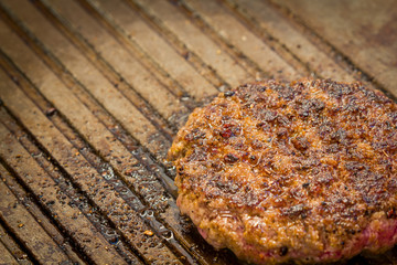 Golden burger patty before serving.