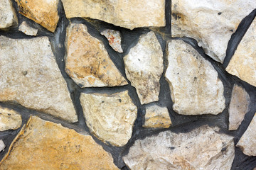 a wall made of natural stone light