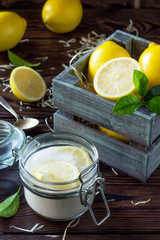 Slices of fresh lemon in sugar and fresh lemons on the kitchen table. The concept of healthy nutrition and diet.