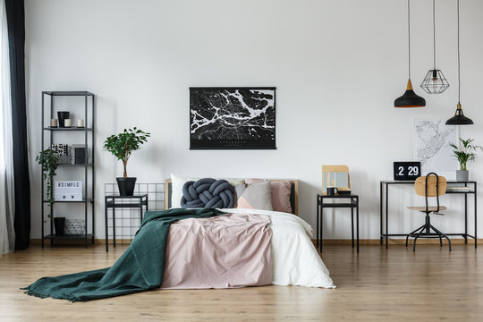 Black map poster above bed